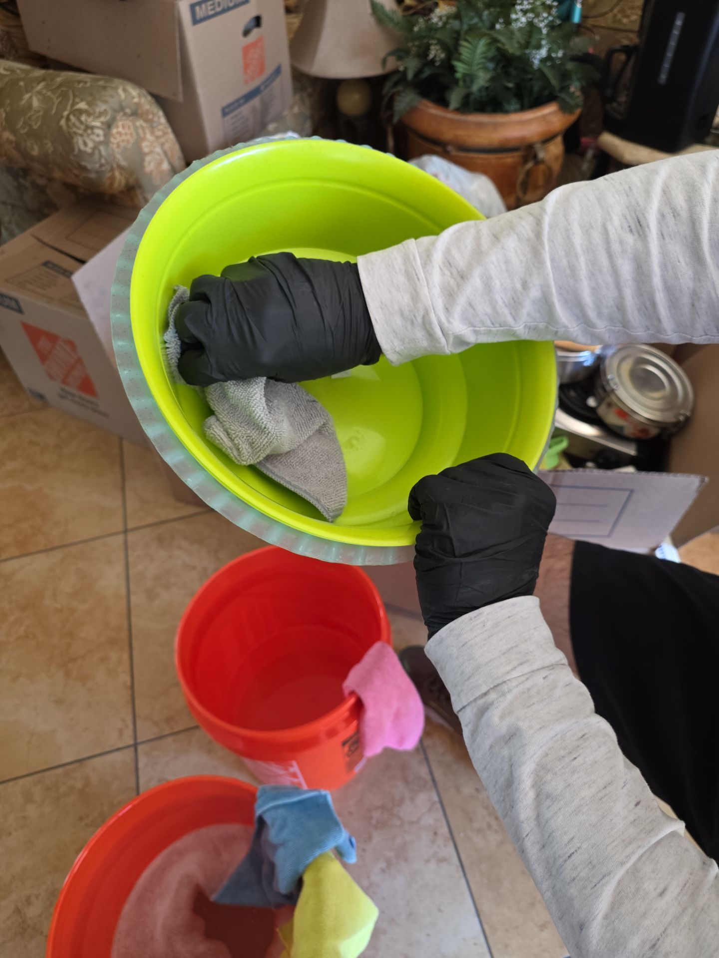 Technician in gloves cleaning contents after fire and smoke damage